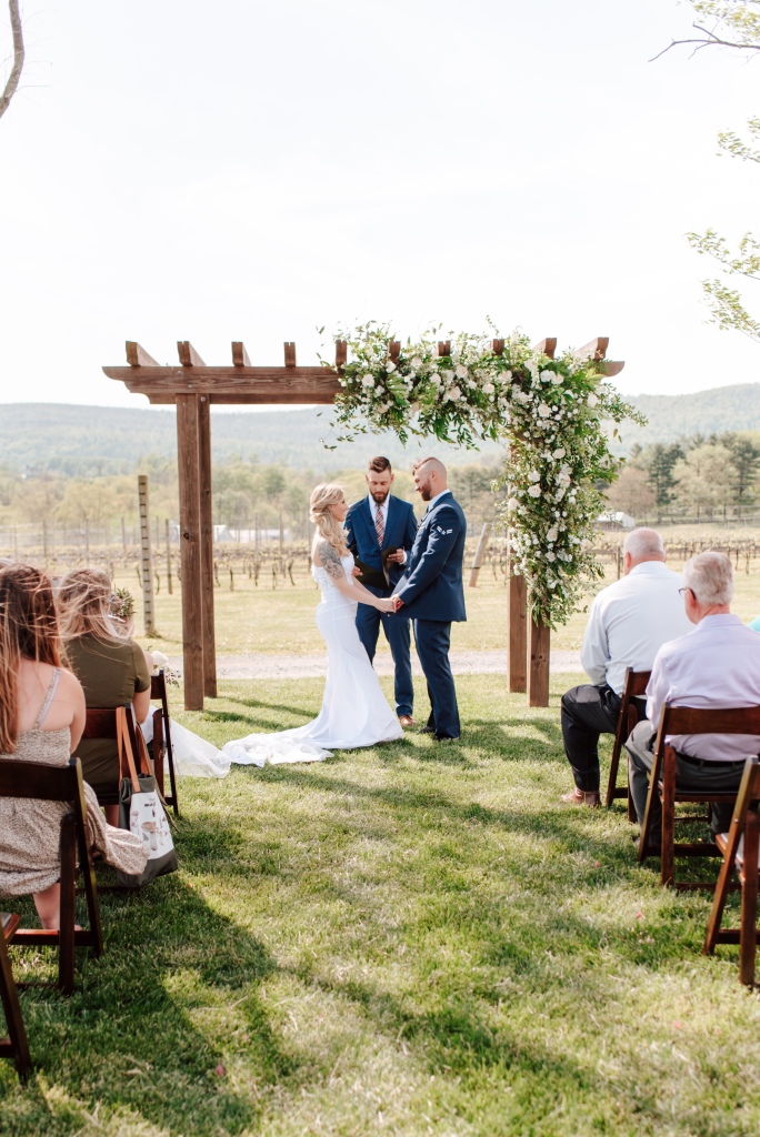 Winery vineyard wedding ceremony floral arch