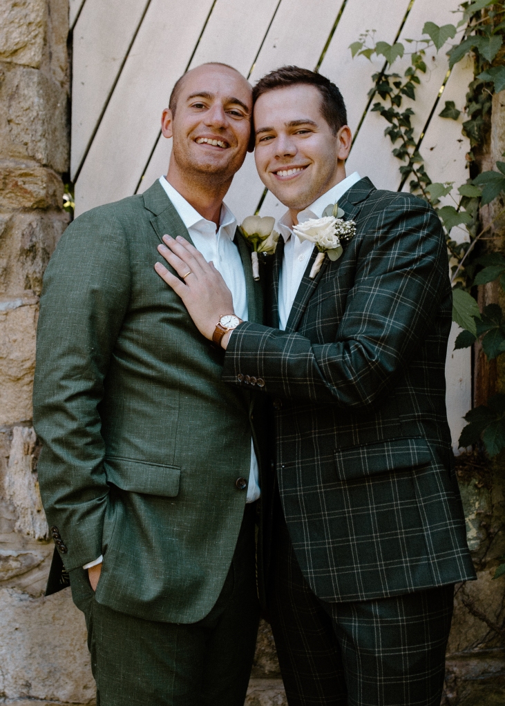 LGBTQ wedding with grooms and boutonnieres