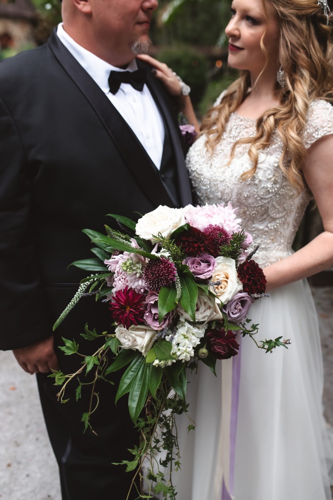 Moody purple wedding flowers and bridal bouquet